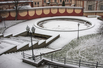 snowy park with a dry fountain
