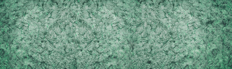 Green textured surface with dark streaks abstract widescreen background