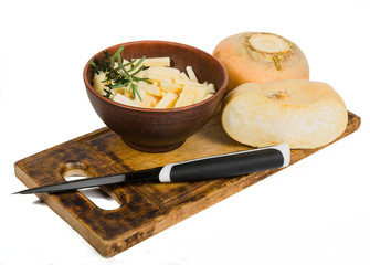 turnip and a knife on a cutting board