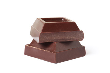 Dark chocolate pieces on white background