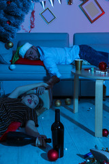 Fototapeta na wymiar Drunk friends sleeping in messy room after New Year party