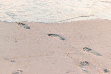footprints in the sea sand