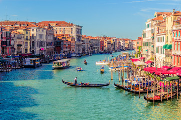 Venice promenade with Church of Santa Maria della Salute in summer sunny day with a gondola sights of Italy in the Adriatic