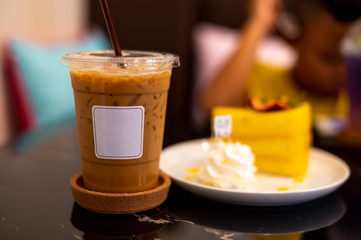 Iced coffee with white label on dark background