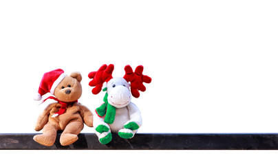Christmas symbol doll. Teddy bears wearing Santa's hats and reindeer doll isolated on white...