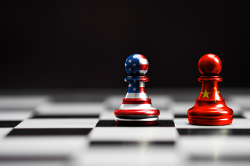 USA flag and China flag print screen on pawn chess with black background.It is symbol of tariff...