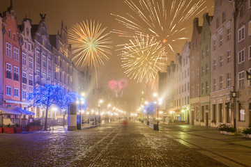 Fototapeta na wymiar Happy New Year fireworks over Old Town of Gdansk. Poland, Europe