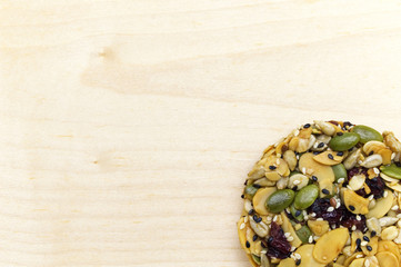 Mix organic whole grains energy cookie on wooden background with copy space.