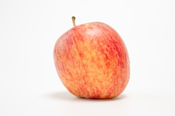 Fresh red apple with droplet on white background. Isolated concept.