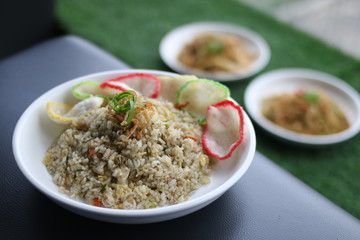 Delicious fried rice with crackers with selective focus