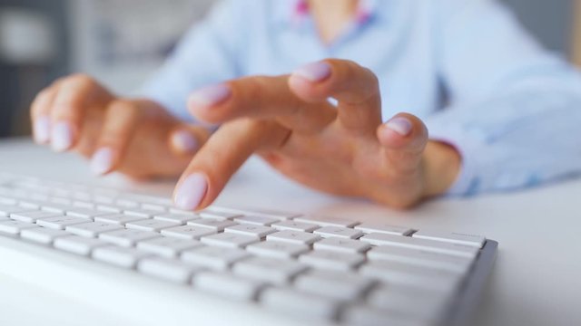 Female hands typing on a computer keyboard. Concept of remote work.