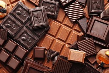 Background of many different pieces of chocolate