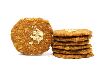 Biscuits homemade Oatmeal flavoured and Thin style. Stack of crunchy delicious sweet meal and useful cookies. Isolated on white background.