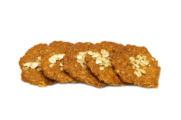 Biscuits homemade Oatmeal flavoured and Thin style. Stack of crunchy delicious sweet meal and useful cookies. Isolated on white background.