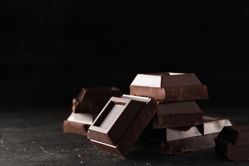 Chocolate bar pieces. Sweet food photo concept. The chunks of broken chocolate