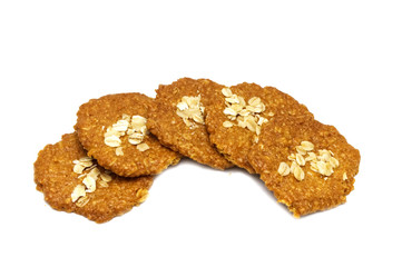 Biscuits homemade Oatmeal flavoured and Thin style. Stack of crunchy delicious sweet meal and useful cookies. Isolated on white background.
