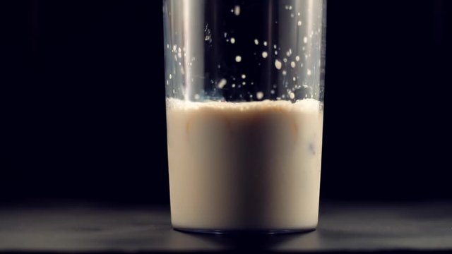 Milk Shake With Fruits In Slow Motion.Blender With Milk.Healthy Vegan Smoothie With Fruits Close Up.Smoothie Blended In Slow Motion.Banana And Strawberry For Healthy Red Milk Shake Fitness Cocktail.