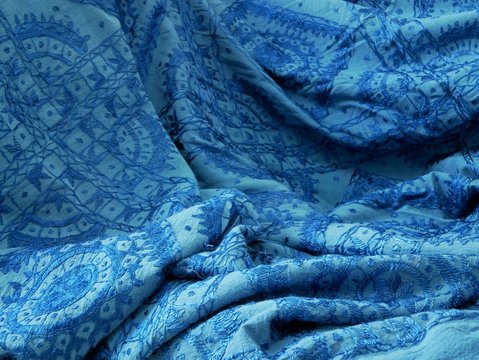Blue indian arab textile tribal pattern closeup