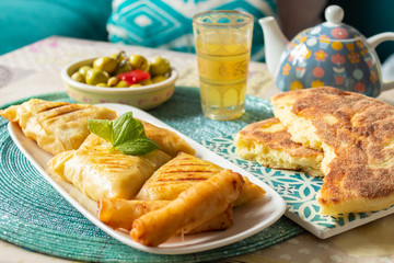 Arab chicken briwats on white plate