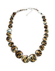 Snake-print mug beads on white isolated background