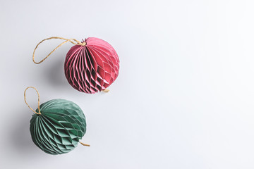 Christmas background with trendy paper decorations on white backdrop. Top view. Copy space. Flat lay