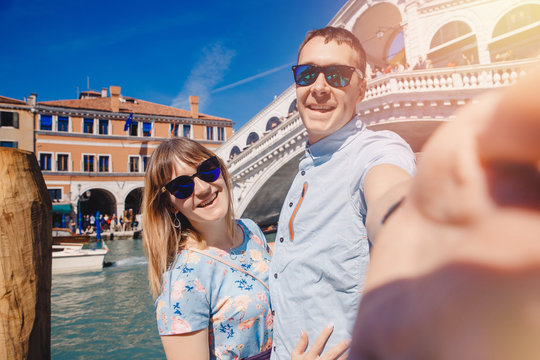 Selfie lover couple taking photo travel Venice, Italy against backdrop great canal and bridge