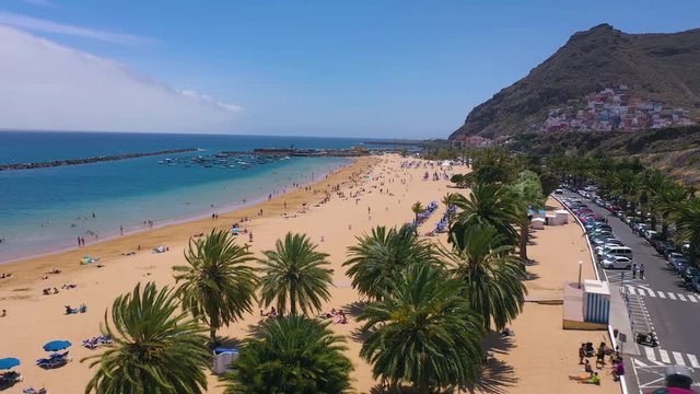 Aerial view of Las Teresitas beach, road, cars in the parking lot, golden sand beach and the Atlantic Ocean. Tenerife, Canary Islands, Spain