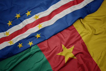 waving colorful flag of cameroon and national flag of cape verde.
