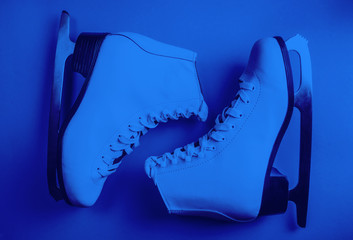 White figure ice skates. Winter holidays concept. Blue color of the year 2020 concept. Top view. Flat lay