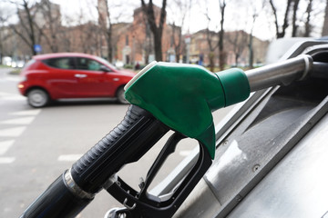 Italy , Milan december 15,2019 - to make gasoline to the car - Eni petrol pump in the city - green...