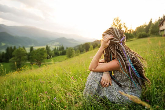Beautiful dreadlock woman in mountains