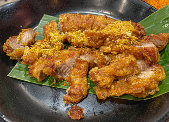 A Streaky pork fried on banana leaf,traditional Thai food, asia crusine.