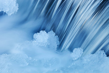 Winter cascade framed by ice, Comstock Creek, Michigan, USA