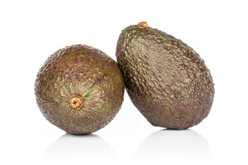 Group of two whole fresh green avocado isolated on white background