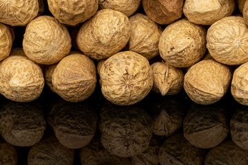 Lot of whole tasty beige peanut isolated on black glass