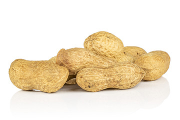 Lot of whole tasty beige peanut isolated on white background