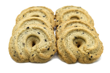 Biscuit with black sesame and honey flavored. A stack of crunchy delicious sweet meal and useful cookies. Isolated on white background.