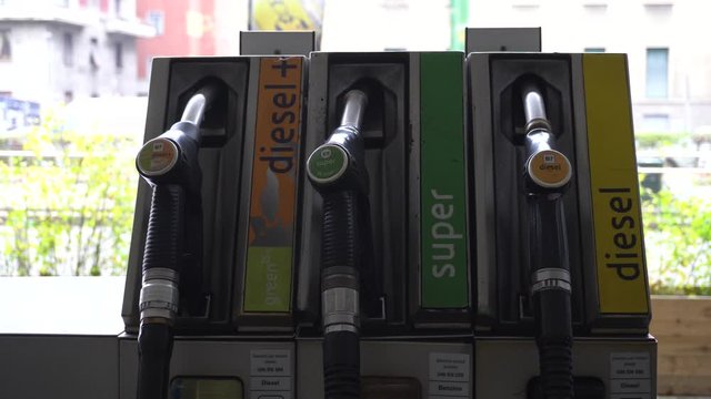 Italy , Milan december 15,2019 - to make gasoline to the car - Eni petrol pump in the city - green petrol, diesel and diesel +