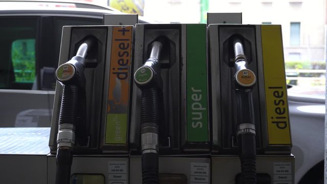 taly , Milan december 15,2019 - to make gasoline to the car - Eni petrol pump in the city - green petrol, diesel and diesel +