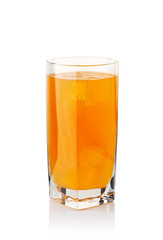 orange drink in a glass with ice cubes