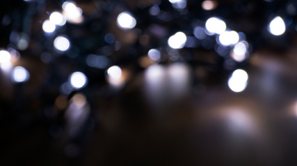 Abstract light, bokeh effect, new year lights. Dark background, bokeh light.