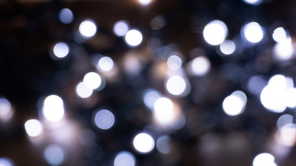 Abstract light, bokeh effect, new year lights. Dark background, bokeh light.