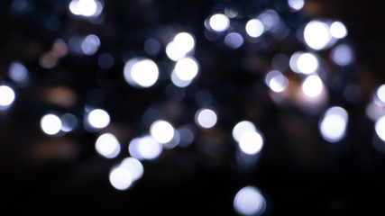 Abstract light, bokeh effect, new year lights. Dark background, bokeh light.