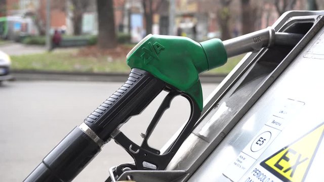 taly , Milan december 15,2019 - to make gasoline to the car - Eni petrol pump in the city - green petrol, diesel and diesel +