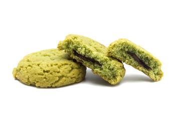 Soft cookies green tea flavored filled with chocolate cream isolated on white background.