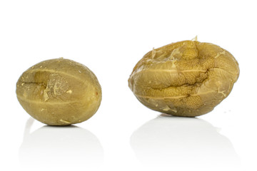 Group of two whole pickled green caper isolated on white background