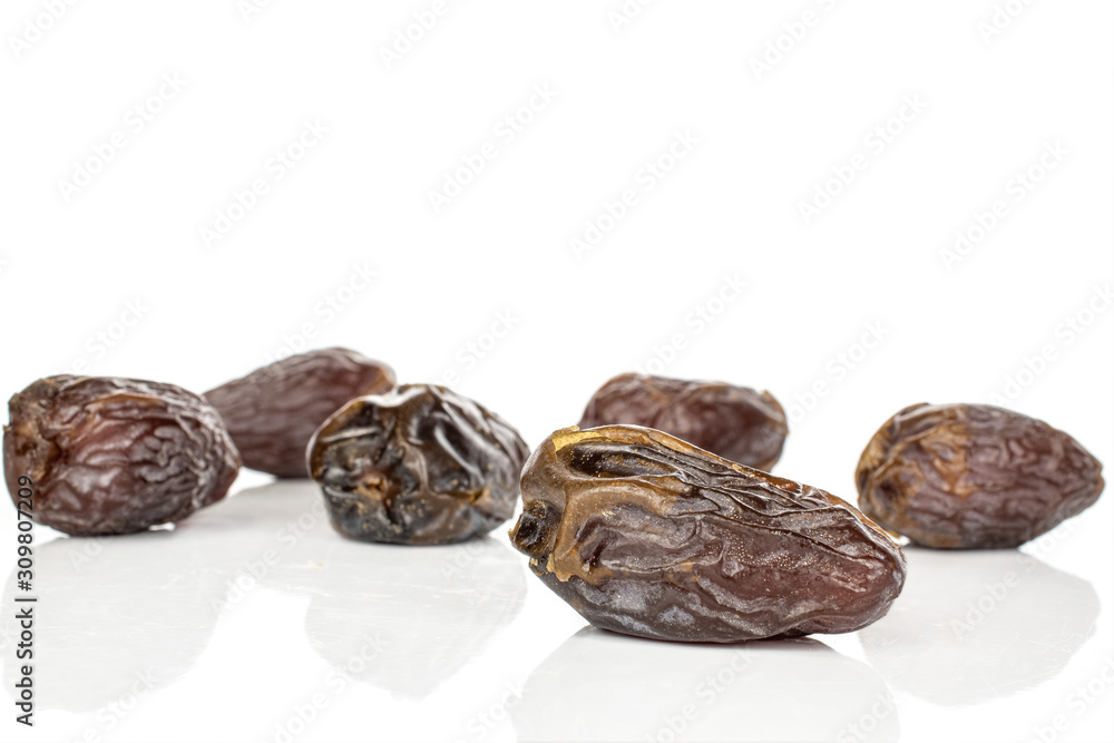 Wall mural group of six whole dried brown date fruit isolated on white background