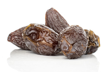 Group of five whole dried brown date fruit stack isolated on white background
