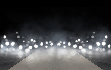 Wet asphalt, reflection of neon lights, a searchlight, smoke. Abstract light in a dark empty street...