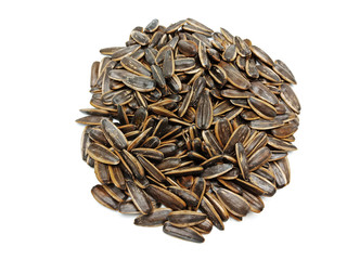 Sunflower seeds pile against isolated on white background. Roasted and Salted in the original flavor. Great nutritous and rich with oil which makes it a high energy source. Snack for diet and healthy.